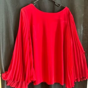 Holiday blouse with sheer flowing sleeves.